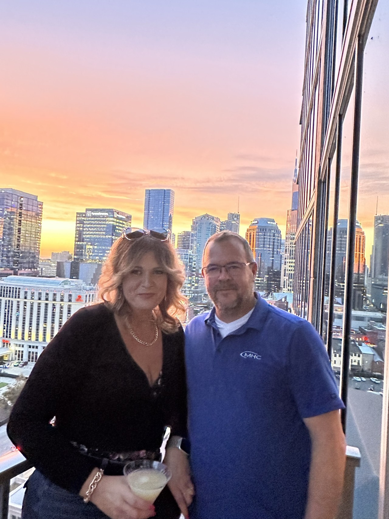 Couple on balcony at sunset